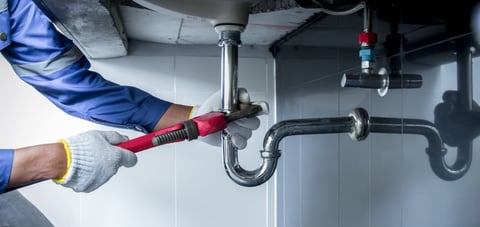 Professional plumber at work