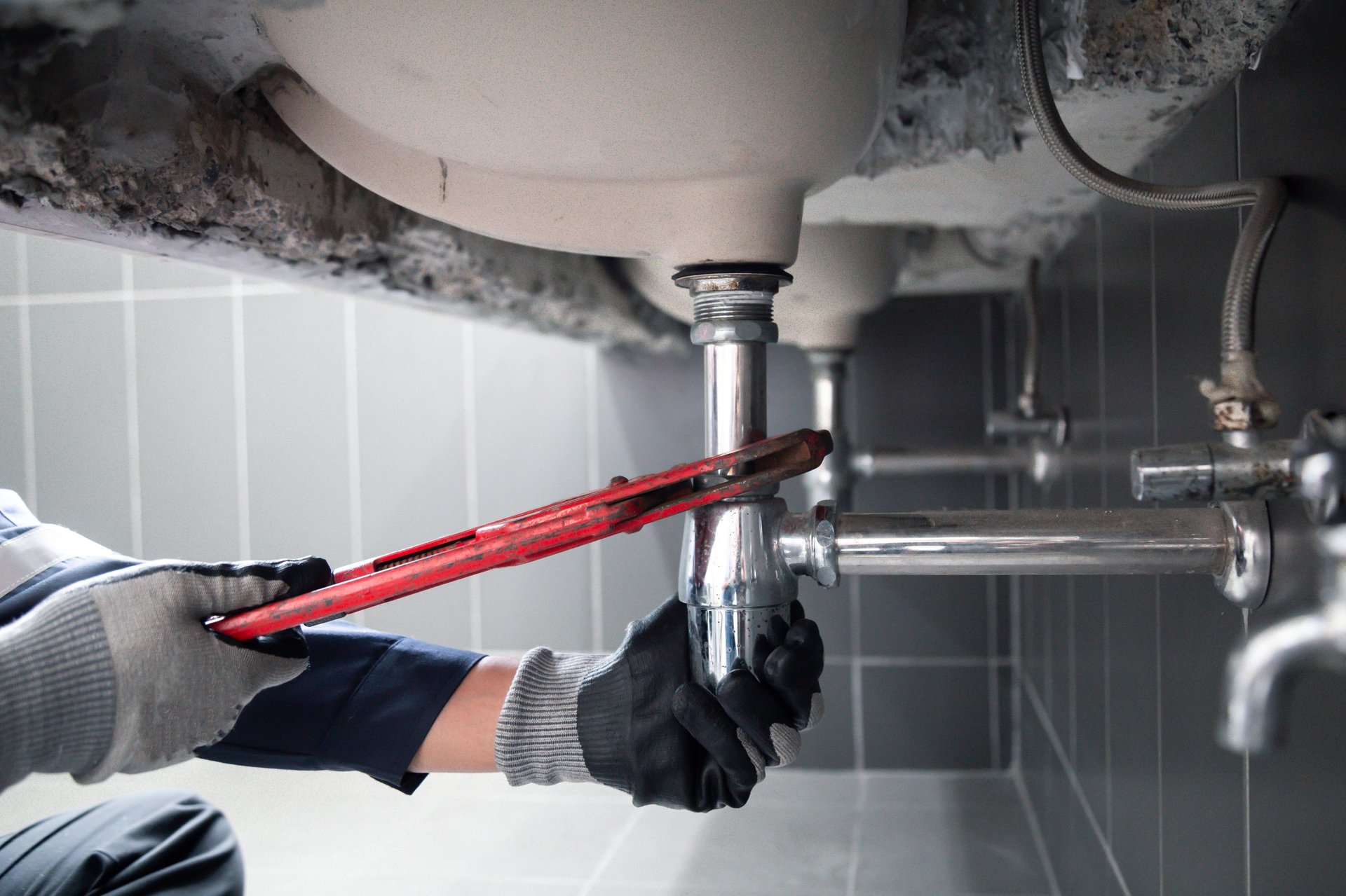 Professional plumber at work